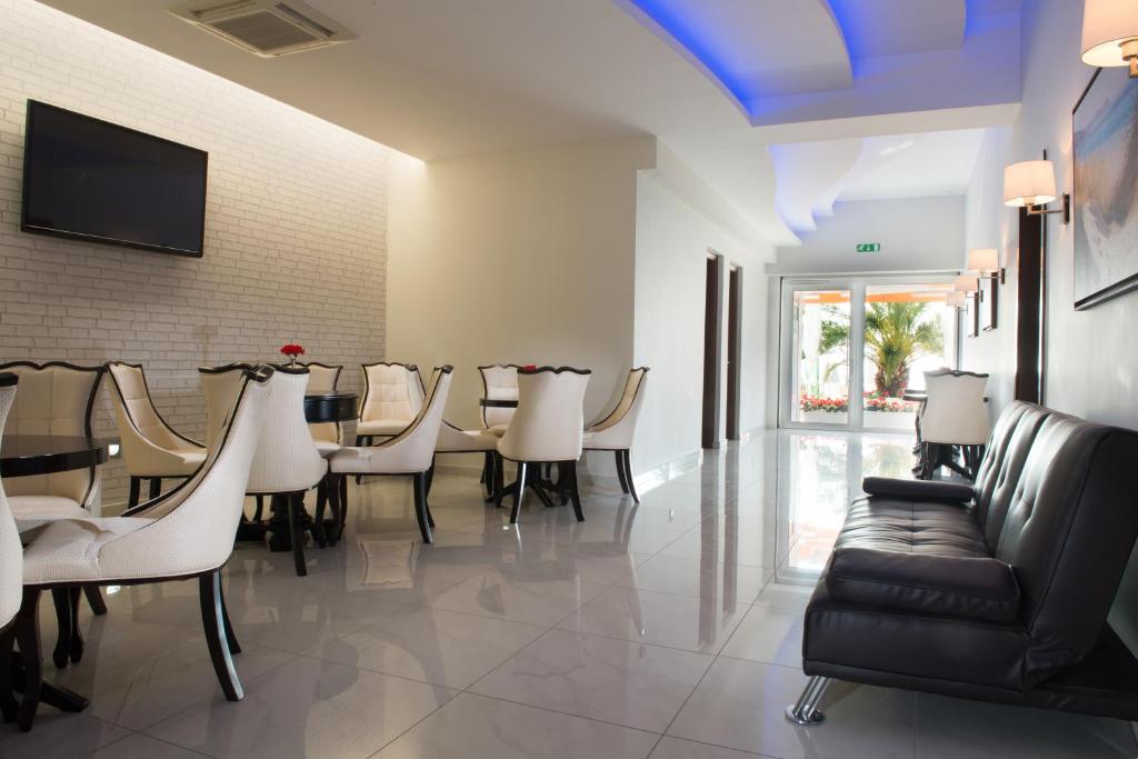 Reception with a sofa, chairs and tables